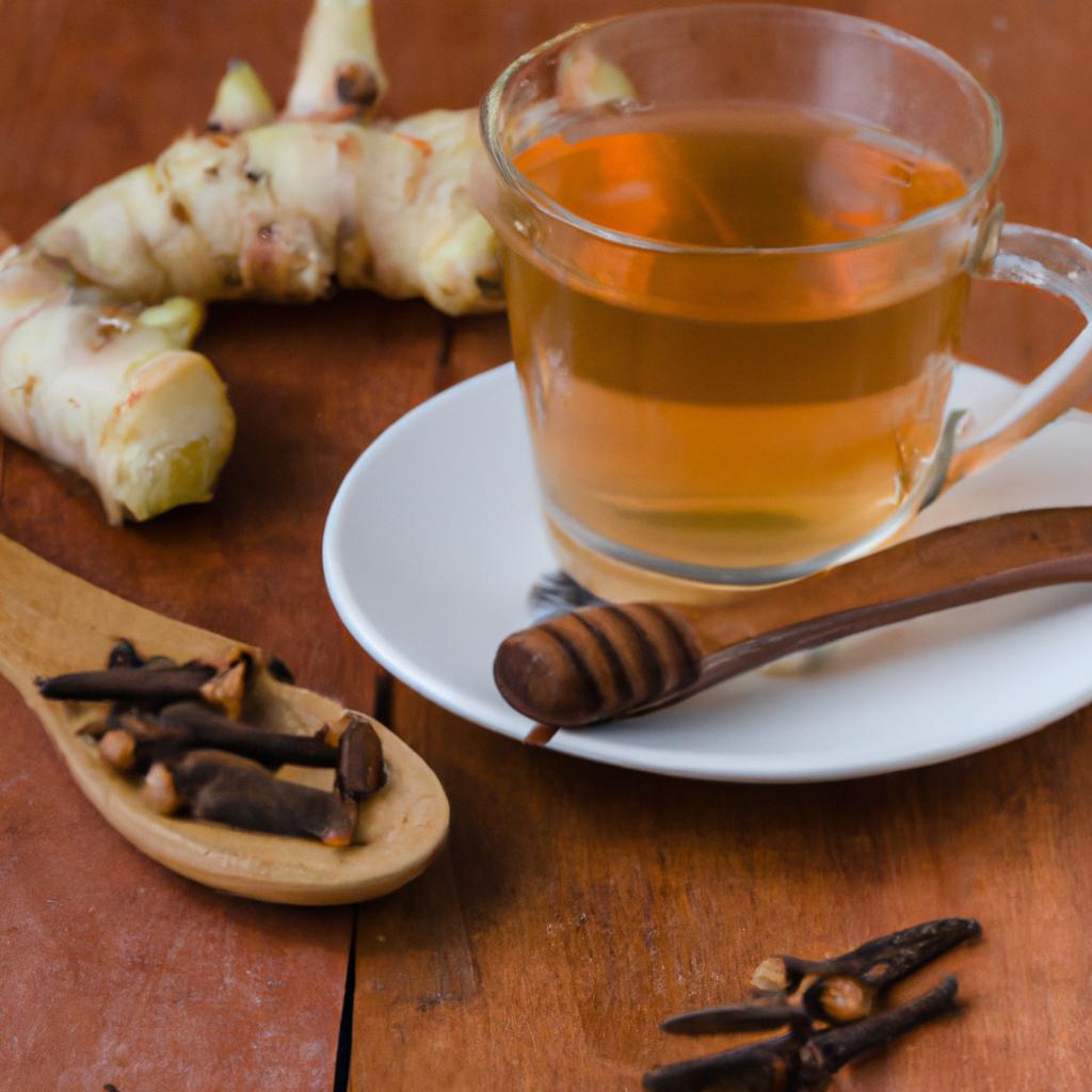A steaming cup of ginger and cloves tea with honey, served on a cozy woolen blanket.